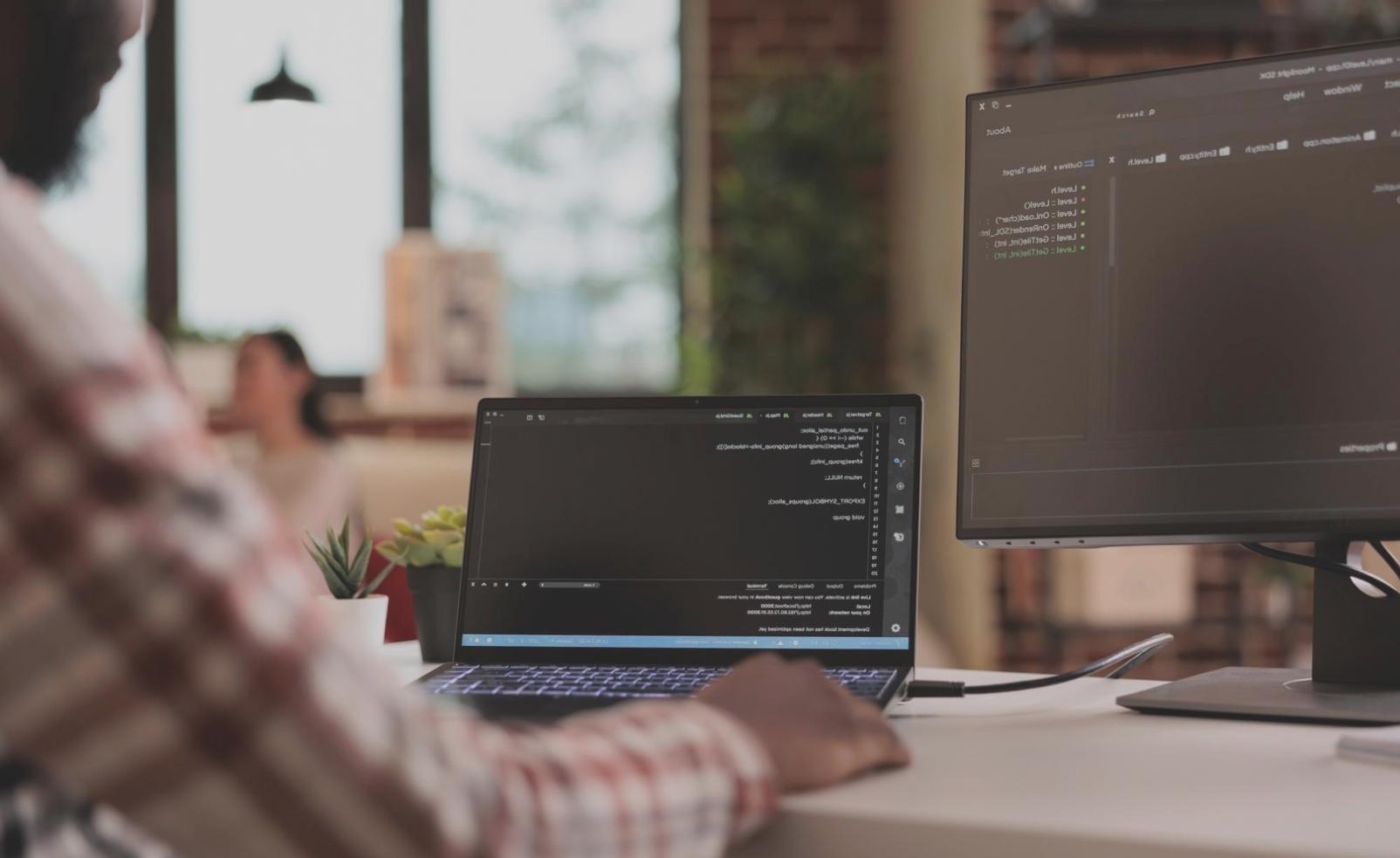 Students collaborating on a 3D game project with detailed character models and environments